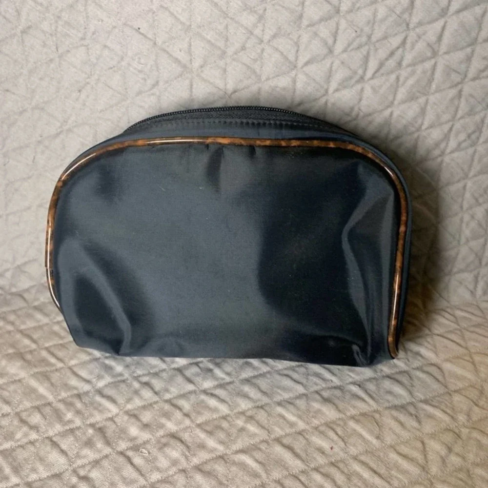 𝅺5/ $25 Cosmetic World black makeup bag with animal print